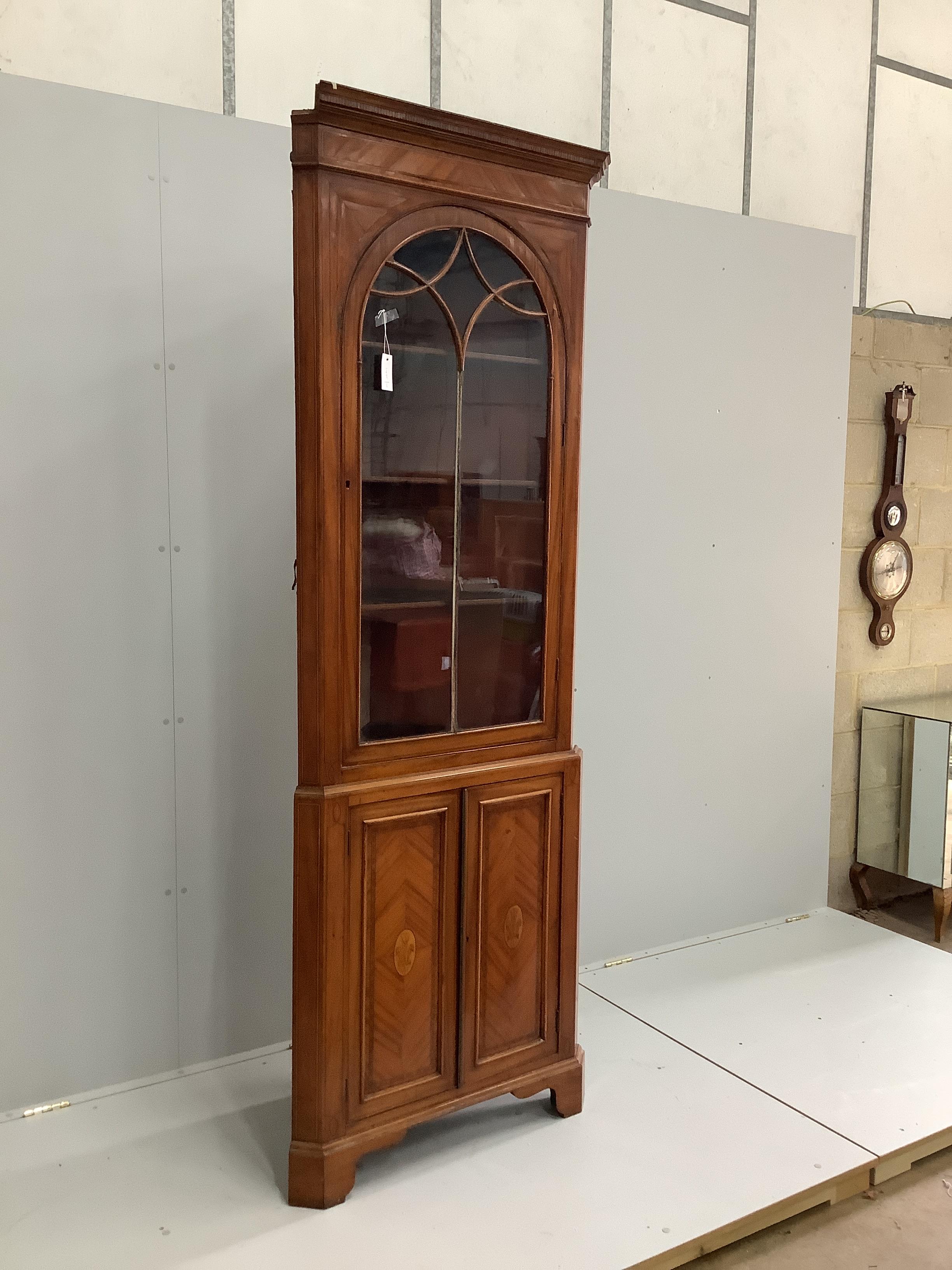 An Edwardian Sheraton revival inlaid satinwood standing corner cabinet, width 78cm, depth 40cm, height 223cm